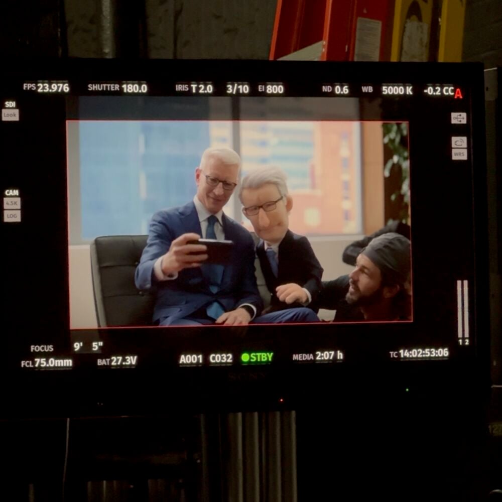 Anderson Cooper and his look alike custom puppet, seating together and taking a selfie