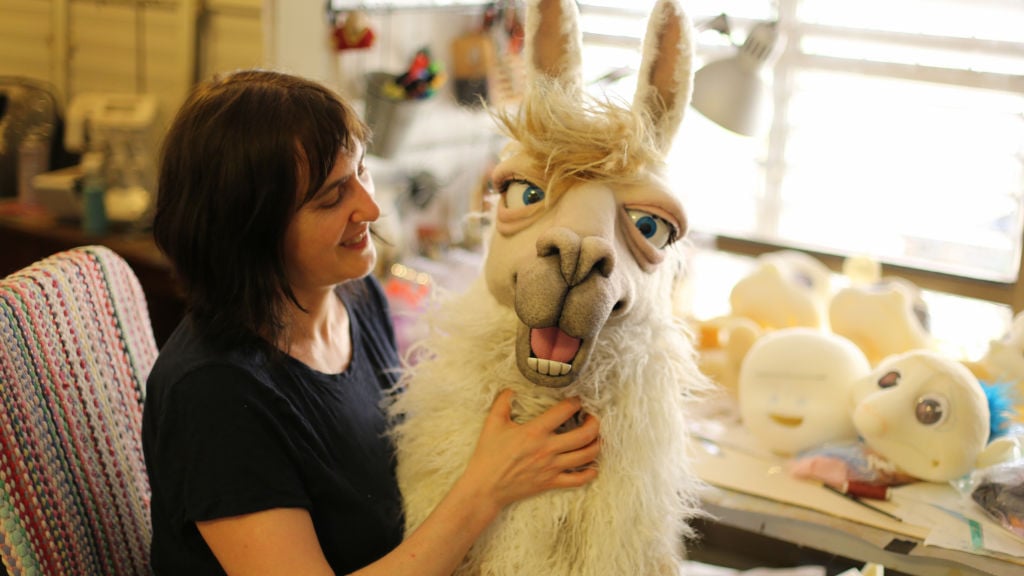 llama puppet costume with mechanical eyes